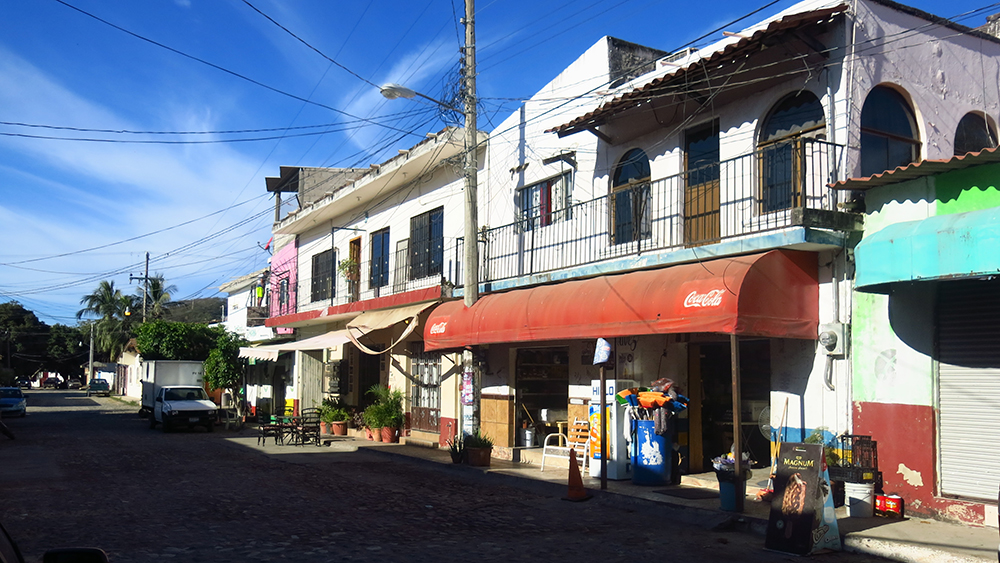 Telegraph wires and cobble stones in a quiet street in La Cruz