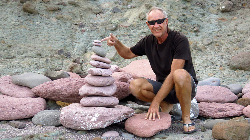 Neil building a rocky sculpture at Bahia San Francisco